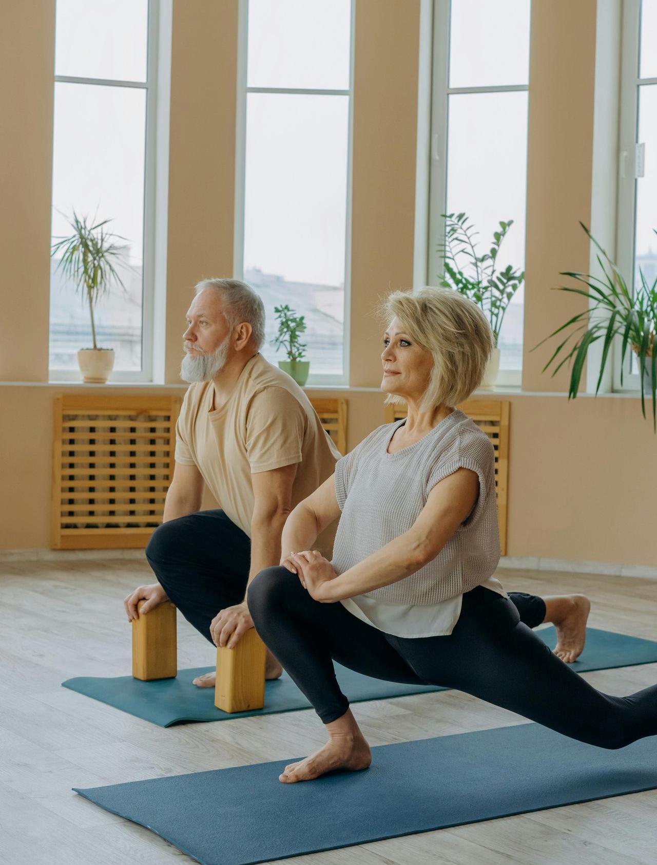 senior couple in yoga session