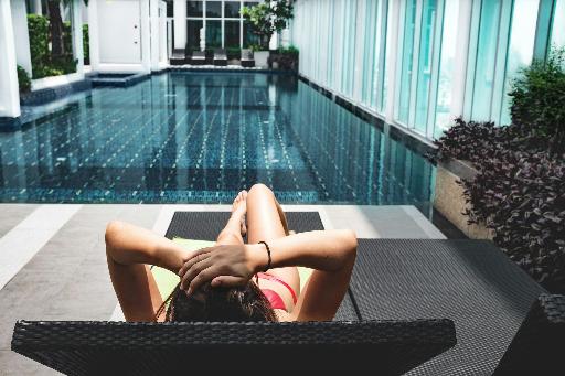 photo of a woman in front of her pool